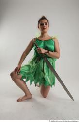 Woman Adult Average White Fighting with sword Kneeling poses Casual